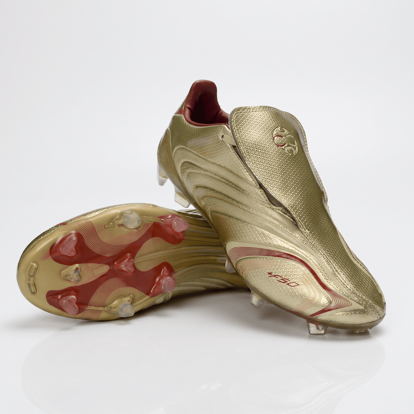 F50+ Laceless FG Gold Metallic / White / Core Black - Elite Boots