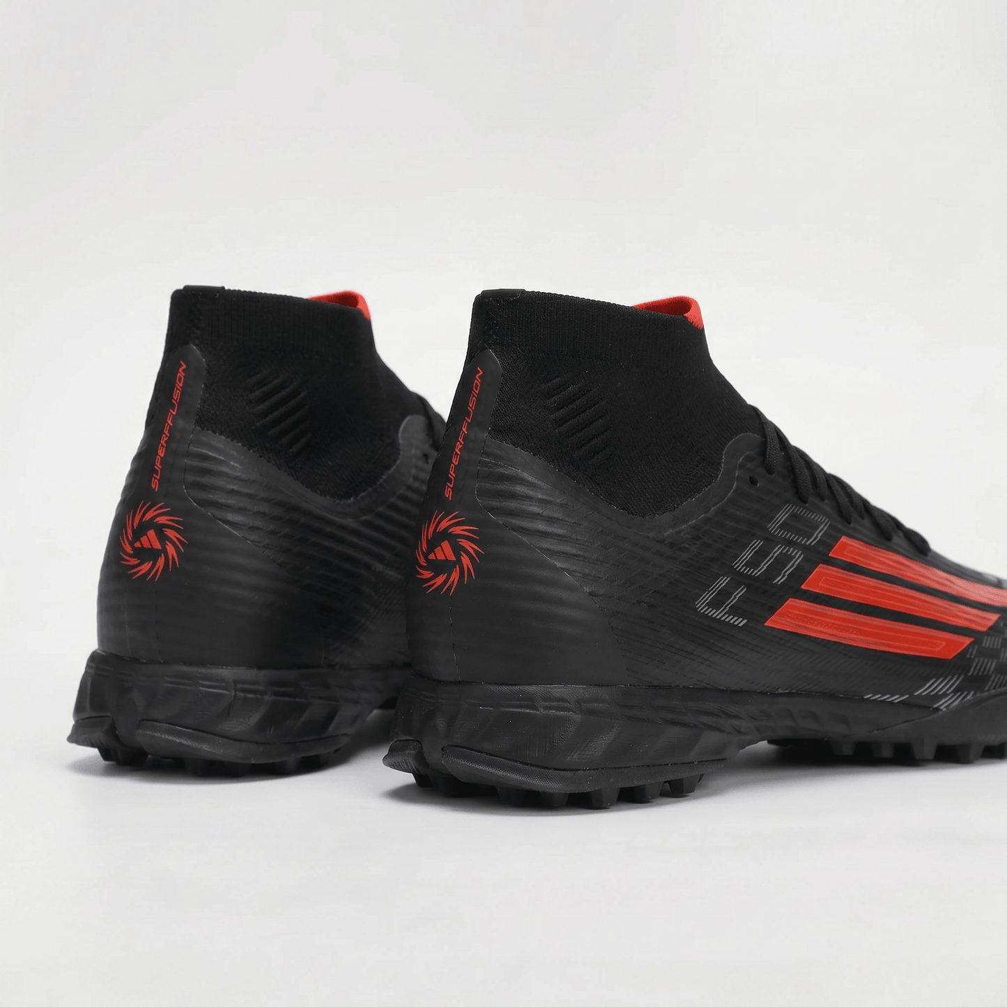 F50 Sparkfusion Pro Mid TF/Color: Core Black / Solar Red / Iron Metallic - Elite Boots
